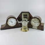 An anniversary clock, contained under a glass dome, 22cm tall,