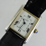 A Must de Cartier ladies wristwatch, on a black leather strap, together with an additional strap,