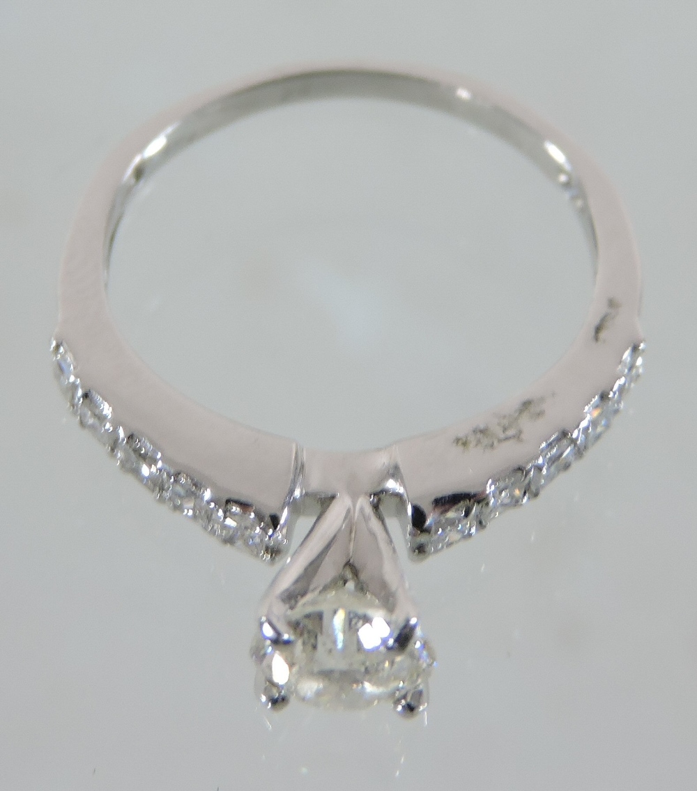 An 18 carat white gold diamond solitaire ring, approximately one carat, - Image 2 of 4