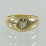 An 18 carat gold and diamond set gypsy ring