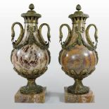 A pair of French style gilt metal mounted marble cassolettes, each of baluster shape,