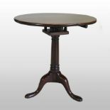 A George III mahogany circular tilt-top occasional table, with bird cage action,