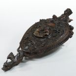 A pair of 19th century continental carved walnut bellows, carved throughout with masks,