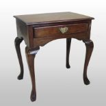 An 18th century mahogany lowboy, containing a single frieze drawer, on cabriole legs,