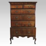 An 18th century walnut and chevron strung chest on stand, with a cavetto moulded cornice,