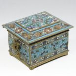 A Russian bronze and champleve enamel miniature casket, of rectangular shape with a hinged lid,