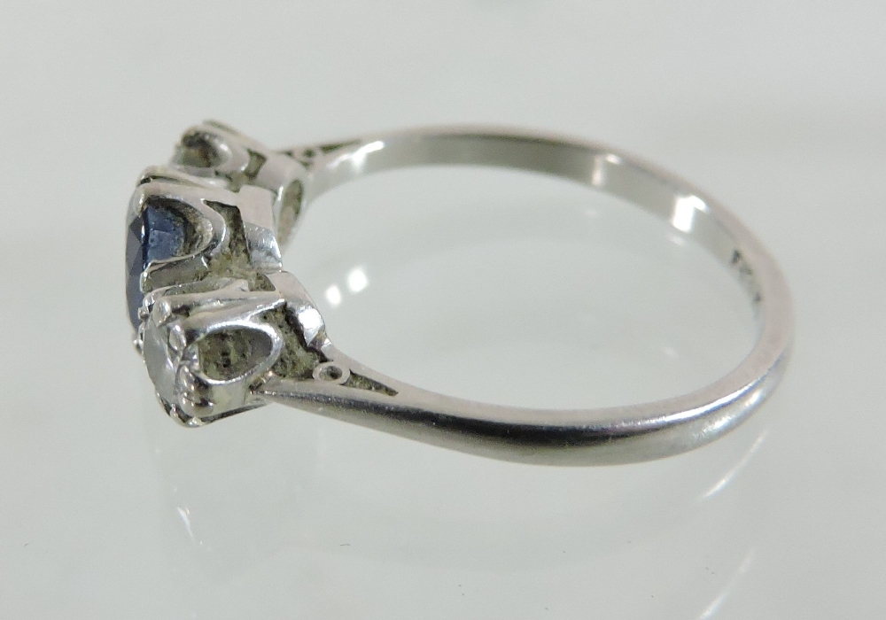 A platinum set sapphire and diamond three stone ring, - Image 4 of 5