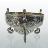 A Victorian silver bon-bon dish, of half-gadrooned circular shape on three scrolled feet,