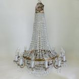 A twelve branch gilt metal and cut crystal chandelier,
