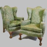 A pair of early 20th century Queen Anne style green upholstered armchairs,
