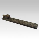 An early 19th century Scandinavian carved fruitwood mangling board,