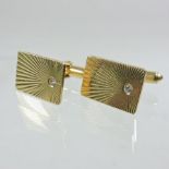 A pair of 14 carat gold and diamond set gentlemen's cufflinks,