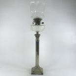 A large 19th century silver plated oil lamp, in the form of a Corinthian column,