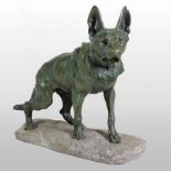A large bronze model of a German Shepherd dog, on a carved stone base,