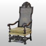 An early 20th century carved walnut throne chair, in the Carolean taste,