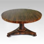 A Regency rosewood breakfast table, having a hinged circular top,