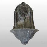 A 19th century lead wall fountain, relief decorated with a lion's mask,