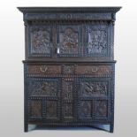 A 19th century heavily carved dark oak side cabinet,