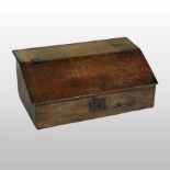 An 18th century oak Bible box, fitted with drawers and enclosed by a hinged sloping fall, 74cm,