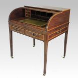 A George III mahogany and satinwood crossbanded tambour front writing desk, the fitted interior,