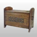 A Liberty style Arts and Crafts oak log box and liner, with stylised carved geometric decoration,