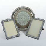 An Edwardian silver photograph frame, of rectangular shape with gadrooned decoration,