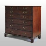 A George III mahogany chest, containing two short over five long drawers, on bracket feet,