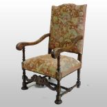 A 19th century carved walnut and tapestry upholstered throne chair, with acanthus carved arms,