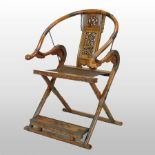 A Chinese elm and brass mounted folding hunting chair, of large proportions,