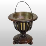 A Dutch coopered wooden bucket, with a brass liner, on three turned feet,