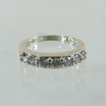 A white gold seven stone diamond ring