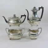 An Edwardian silver four piece tea and coffee service, of rectangular shape, comprising a teapot,