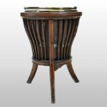 An Edwardian mahogany and boxwood strung jardiniere, with brass liner,