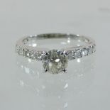 An 18 carat white gold diamond solitaire ring, approximately one carat,
