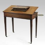 A George III mahogany architect's table, of rectangular shape, having a ratcheted adjustable top,