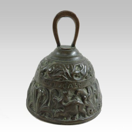 A small antique bronze bell, decorated in relief with a continuous frieze of figures,