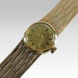 An Omega ladies 9 carat gold cased ladies wristwatch, the dial with baton hours,