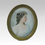 German School, early 20th century, a portrait miniature of a young lady in profile,