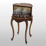 An early 20th century mahogany drinks cabinet, with a revolving fitted interior,