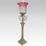A large 19th century brass oil lamp, in the form of a Corinthian column,