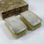 A pair of early 20th century silver backed clothes brushes, inscribed Boy Scouts and monogram J. E.