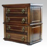 An Aesthetic period walnut chest of small proportions,