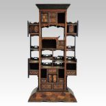 A late 19th century Aesthetic style specimen wood side cabinet, having an arrangement of shelves,