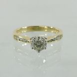 An 18 carat gold and diamond solitaire ring, 0.