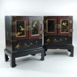 A pair of Japanese Meiji black lacquered table cabinets, each decorated with birds and trees,