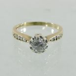 An 18 carat white gold and diamond solitaire ring, approximately 0.