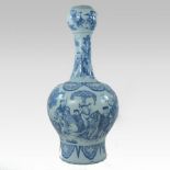 An 18th century delft blue and white vase, of bottle shape,