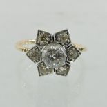 An unmarked diamond seven stone cluster ring, of flowerhead design,