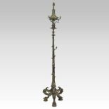 An ornate 19th century gilded cast iron standard lamp, on a shell cast base,