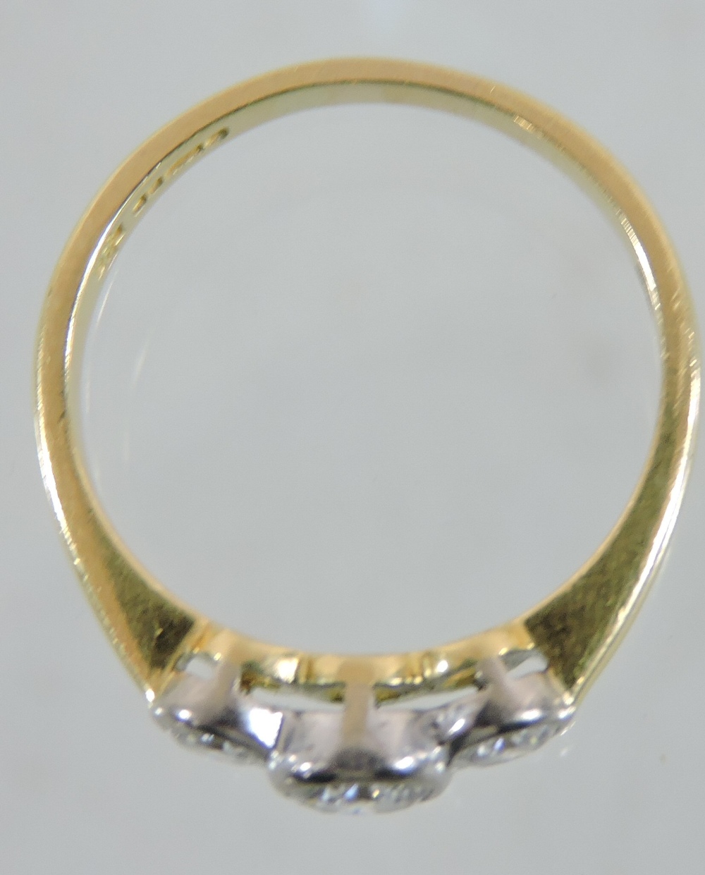 An 18 carat gold and platinum set three stone diamond ring, - Image 3 of 3